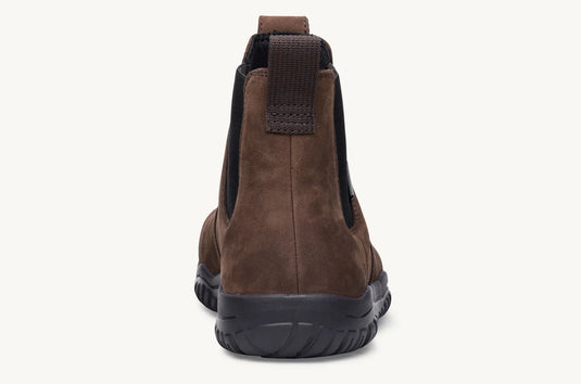 Brown ankle boot with black sole on a white background