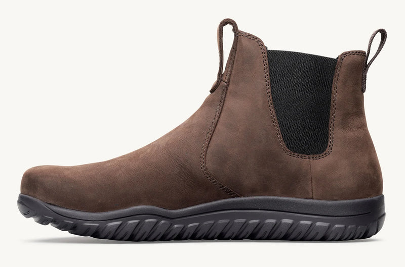 Load image into Gallery viewer, A brown suede Chelsea-style ankle boot with a black elastic side panel and a thick black treaded sole, shown in profile against a light off-white background.

