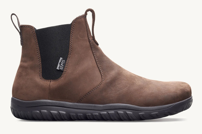 Load image into Gallery viewer, Brown slip-on boot with black sole facing outside.
