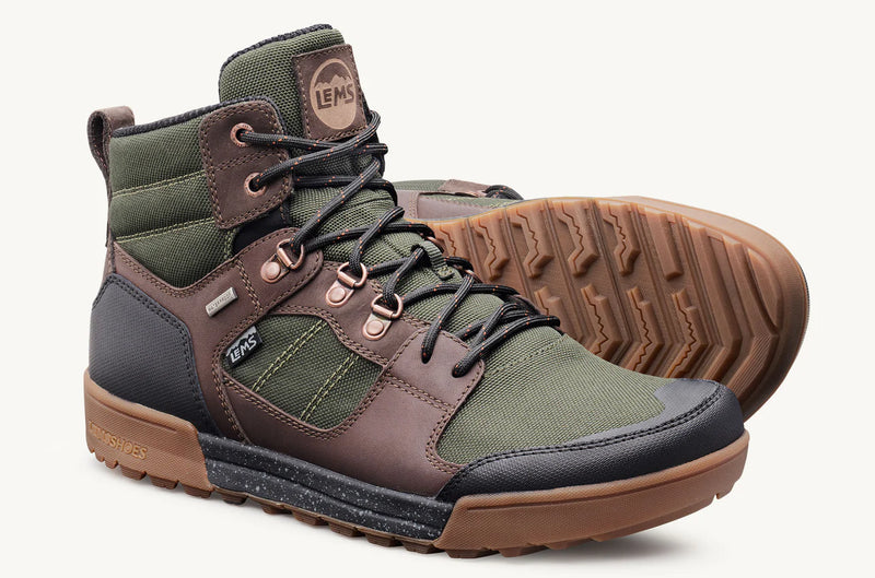 Load image into Gallery viewer, Green and brown hiking boots with visible brand logo with one placed normal and the other on side to show the bottom of the shoe
