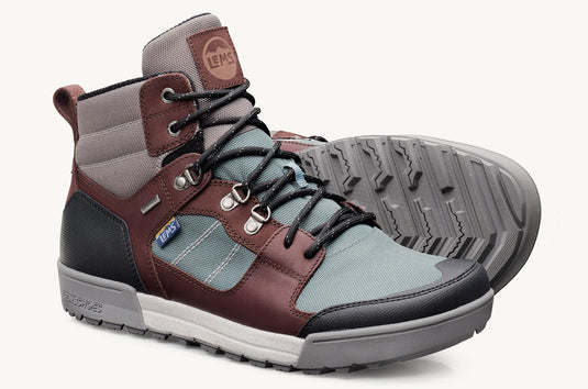 Pair of hiking boots with brown, gray, and blue color scheme on a white background