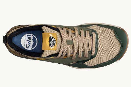 Green and beige sneaker with visible brand logos on a white background